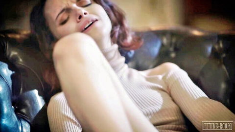 Ecstatic redhead student in sensual turtleneck sweater pose, moaning in heat