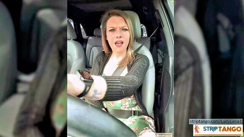 Surprised blonde housewife in car with O-face holding phone during amateur call