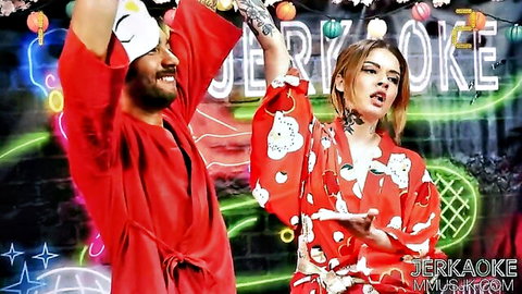 Tattooed couple in colorful kimonos posing with arms raised at neon-lit JERK KOEKE party