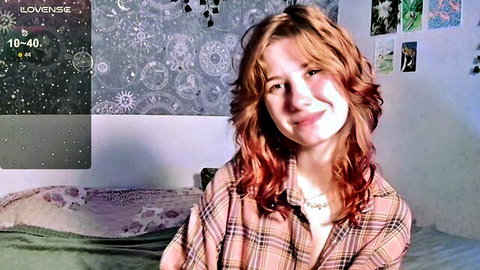 Cute smiling redhead teen webcam girl in unbuttoned plaid shirt teasing cleavage