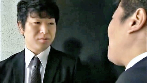 Two Japanese men in suits conversing in Tachibana Yuka JAV censored scene