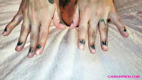 Rick Cannon's tattooed hands spreading exposed pussy close-up