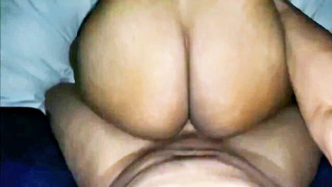 Thick ebony ass cheeks spread wide in doggy style on bed