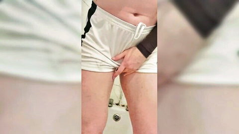 Amateur girl pulls down white shorts teasing crotch in bathroom mirror selfie