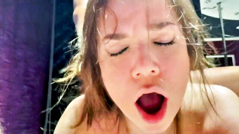 Brunette woman moaning in ecstasy during intense threesome with two men