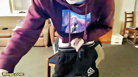 Hairy guy in purple galaxy hoodie pulls down grey shorts to stroke his big hard cock solo on webcam
