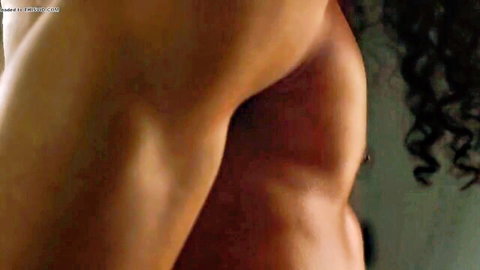 Muscular black guy flexing ripped upper body in gay nude thumbnail