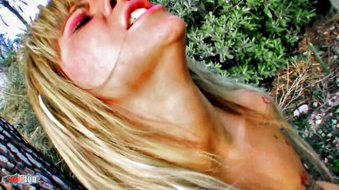 Blonde Terry Kemaco in intense deep throat oral pose outdoors