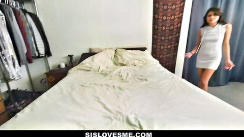 Skinny young brunette in tight short white dress teases by messy bed
