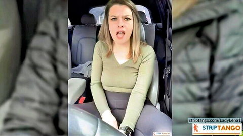 Blonde housewife in car sticks tongue out teasing with cleavage visible