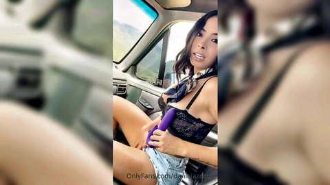 Daniela Antury in black lace lingerie teasing with purple dildo in car