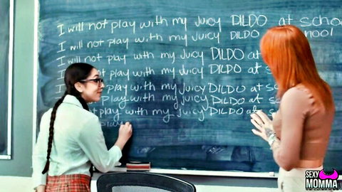 Naughty glasses schoolgirl writes 'juicy dildo at school' lines on blackboard for redhead
