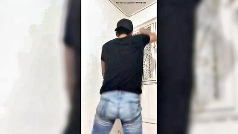Latino man dancing solo, tight jeans highlighting his round ass