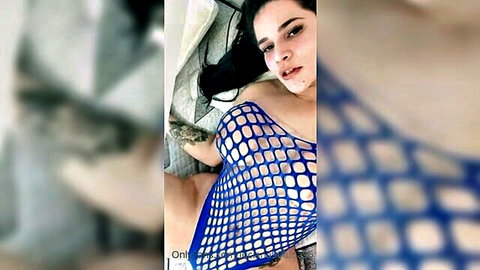 Latina in blue fishnet bodysuit teasing her curves and ass
