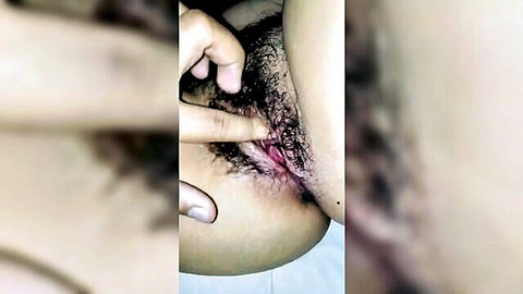 Amateur close-up of virgin girlfriend's hairy pussy with finger touch