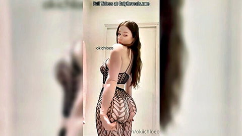 Big ass amateur babe in sheer black fishnet bodysuit teasing her juicy curves from behind