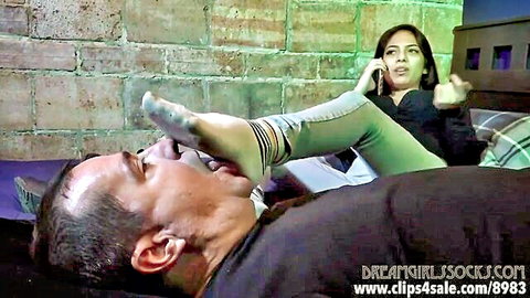 Asian woman dominates man with socked foot in mouth, foot fetish gagging