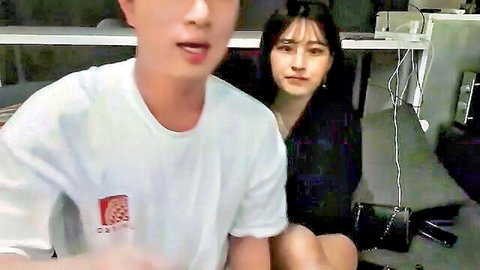 Asian amateur couple, woman under desk in teasing pose
