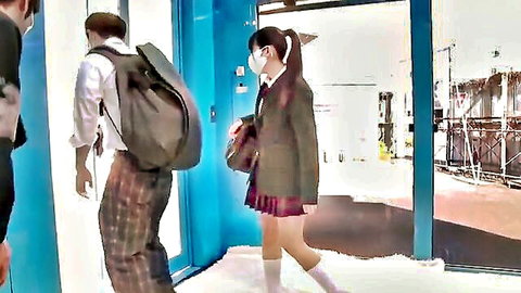 Asian schoolgirl in pleated skirt uniform walking with guy, JAV style