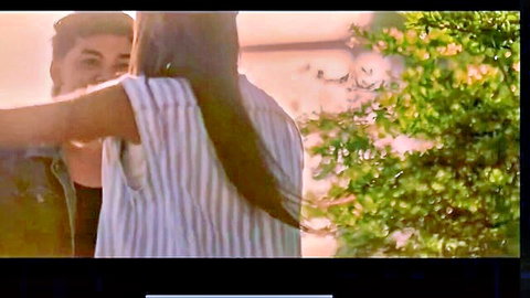 AJ Raval in romantic sunset embrace with lover, long hair flowing
