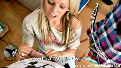 Blonde amateur girl in off-shoulder top teasing man at home party