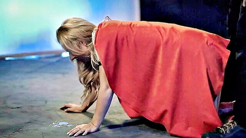 Lexi Belle as Supergirl crawling on all fours in sexy cosplay pose