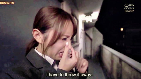 Emotional Japanese schoolgirl in uniform crying and wiping tears in JAV scene
