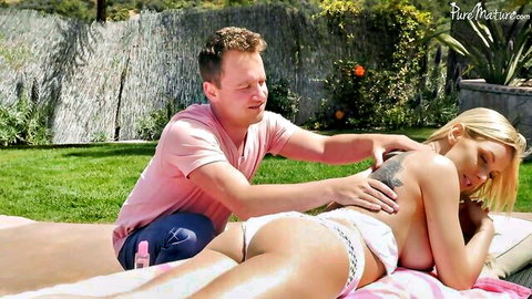 Busty blonde MILF getting sunscreen massage from neighbor outdoors