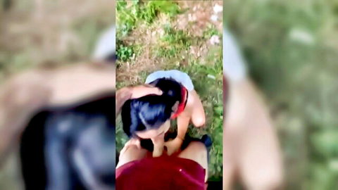 Asian woman deepthroating cock outdoors in POV nature setting