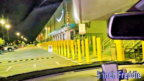 Nighttime Amazon warehouse parking lot view from car with 5 inch Freddie text overlay