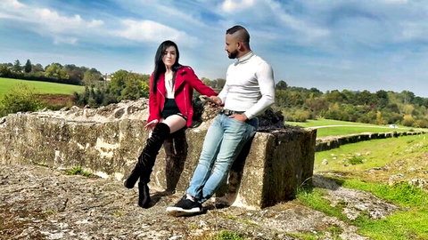 Marina, 31, from Biarritz in red coat and boots with black partner outdoors
