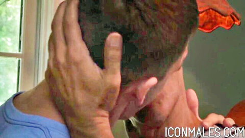 Rough gay daddy grips young guy's head hard from behind in intense encounter