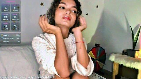Claudiarivera_1 petite Latina cam girl posing with arms up on Chaturbate