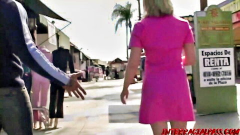Aaralyn in pink dress outdoors with black men for interracial threesome