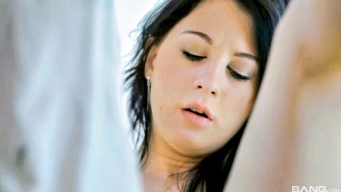 Brunette babe with parted lips and ecstatic eyes during intense blowjob closeup