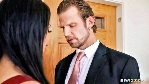 Anissa Kate in red dress gazes at suited Vince Karter in Brazzers wedding scene