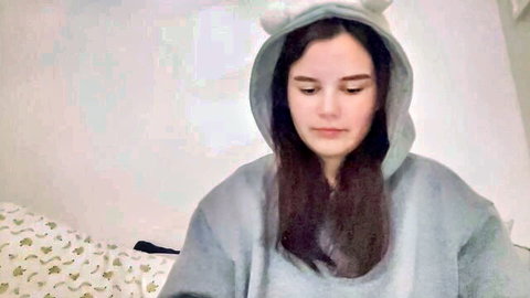 Petite MILF in cute bunny hoodie relaxing on Chaturbate cam