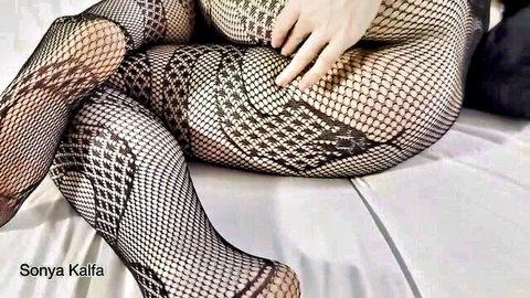 Sonya Kalifa in sheer fishnet lingerie teasing with large booty