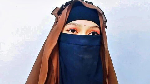 Seductive Indian woman in black niqab with alluring eyes