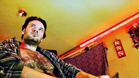 Hairy mature man in open plaid shirt exposing chest in amateur gay teaser