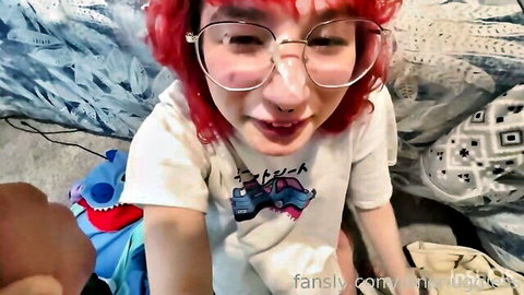Redheaded femboy in glasses and t-shirt, teasing with hand near crotch