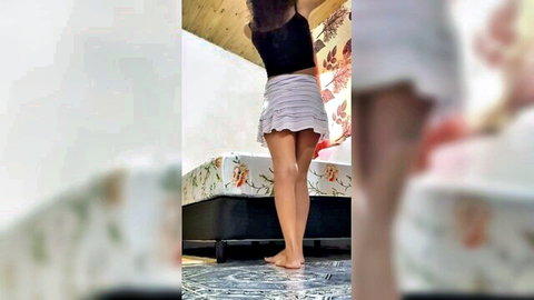 Fit Latina babe upskirt exposing perfect round ass and shaved pussy bending over bed