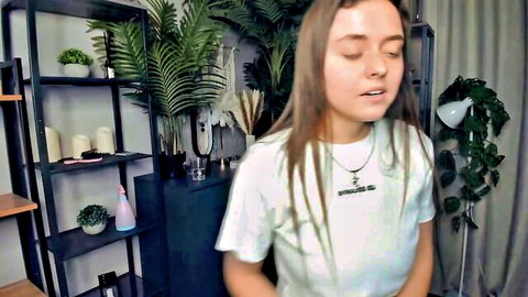 Skinny teen babe in tight white Guess t-shirt smiling on webcam solo tease