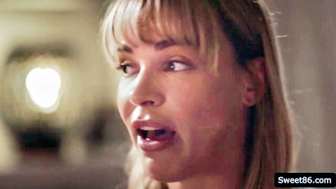 Busty MILF Dana DeArmond open-mouthed close-up in lesbian scene