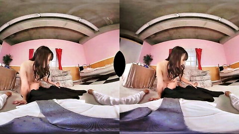 Attractive Asian teen temptress posing topless on bed in seductive solo scene