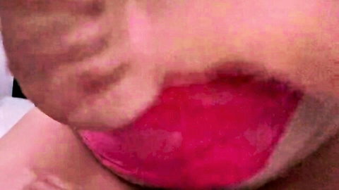Close-up of milf's open mouth with glossy red tongue and lips after oral play