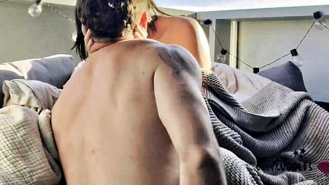 Couple cuddling intimately outdoors after orgasmic pussy licking