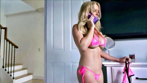 Blonde babe in tiny pink string bikini with massive overflowing tits talking on phone