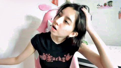 Cute young teen webcam girl in Jerky t-shirt with open mouth and hand in hair teasing seductively