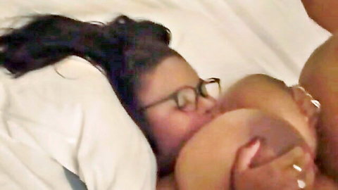 Girl in glasses buries face in chubby ebony's huge tits while squeezing massive brown boobs